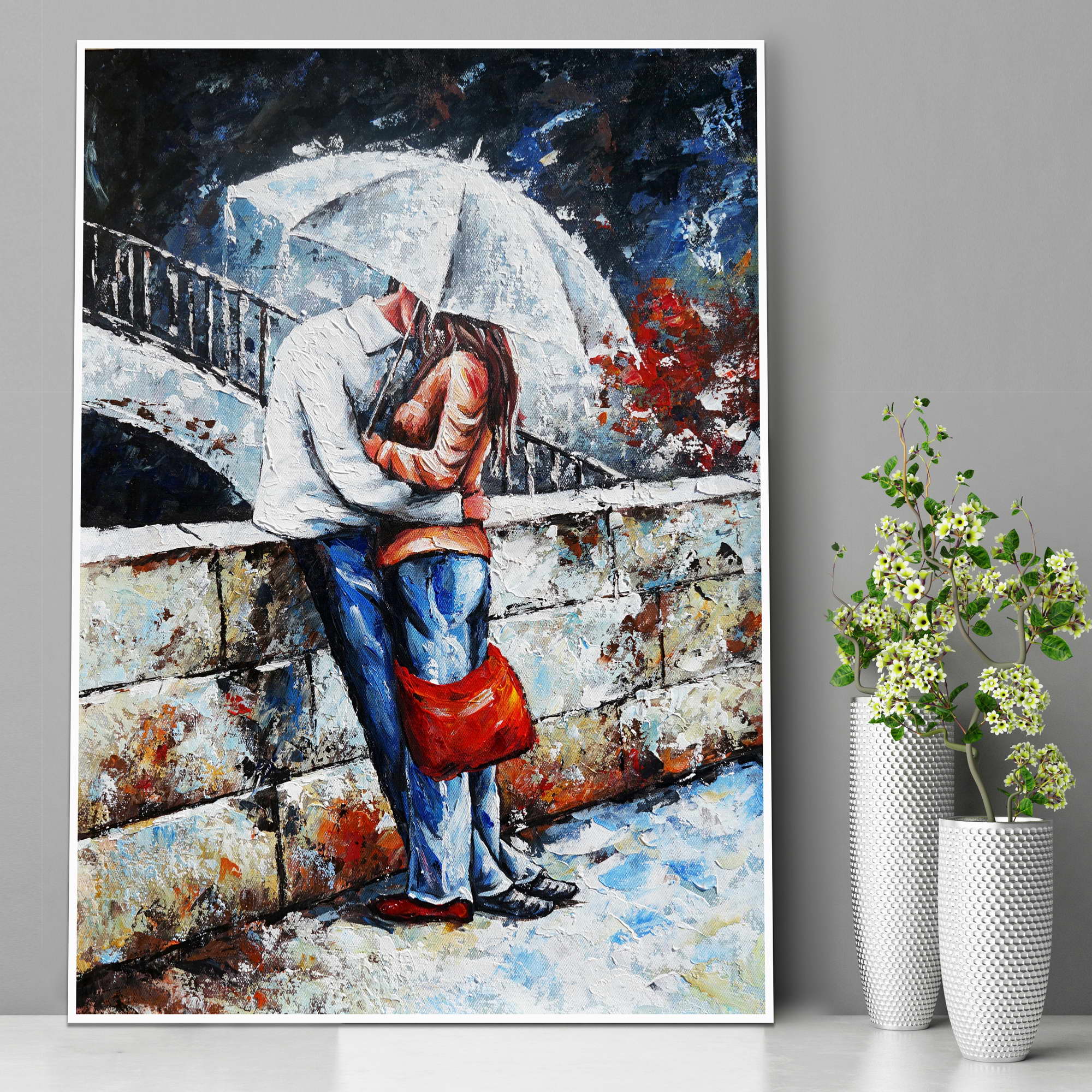Dipinto di una coppia abbracciata coperta da un ombrello