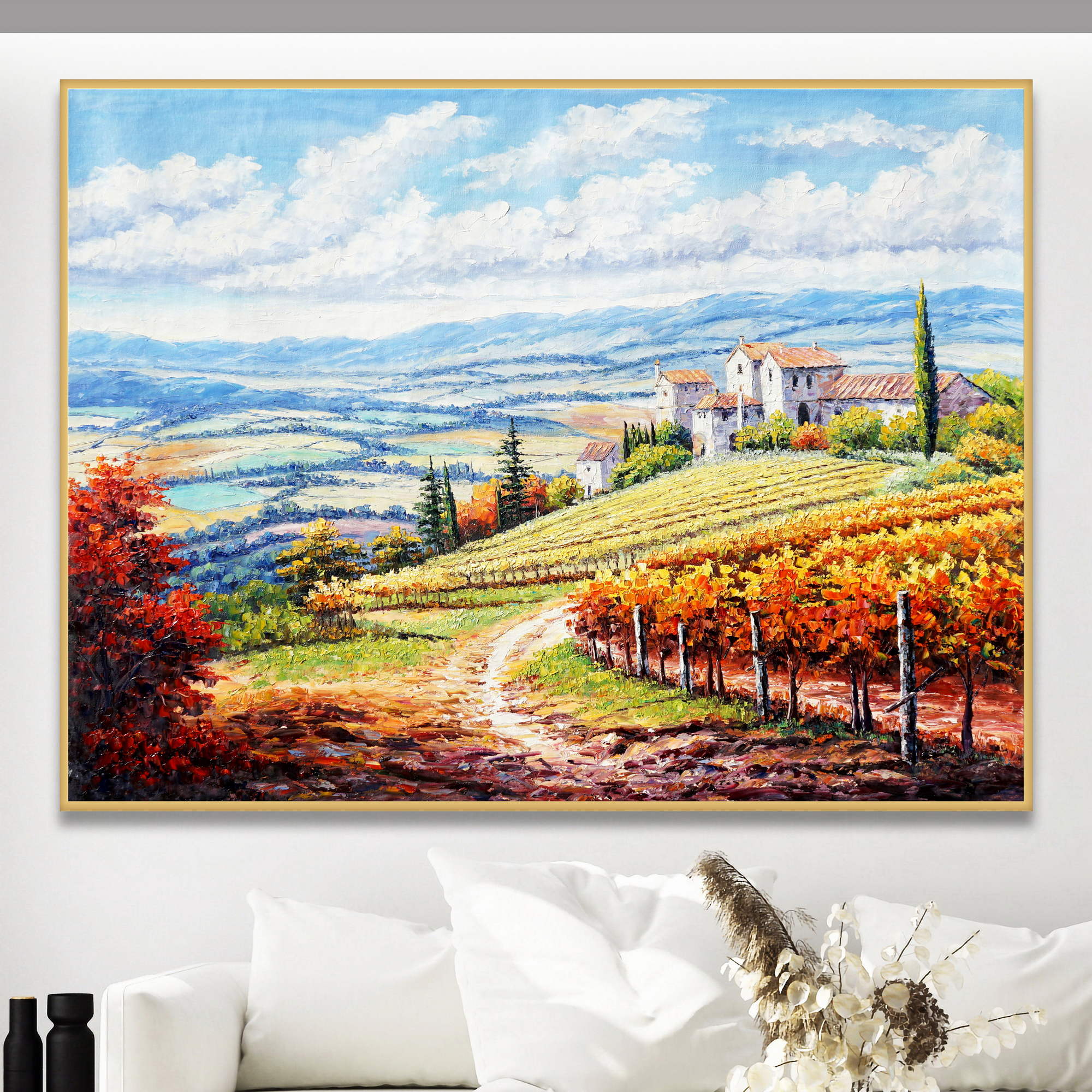 Dipinto di un paesaggio toscano con piccolo borgo si case e vigne in autunno
