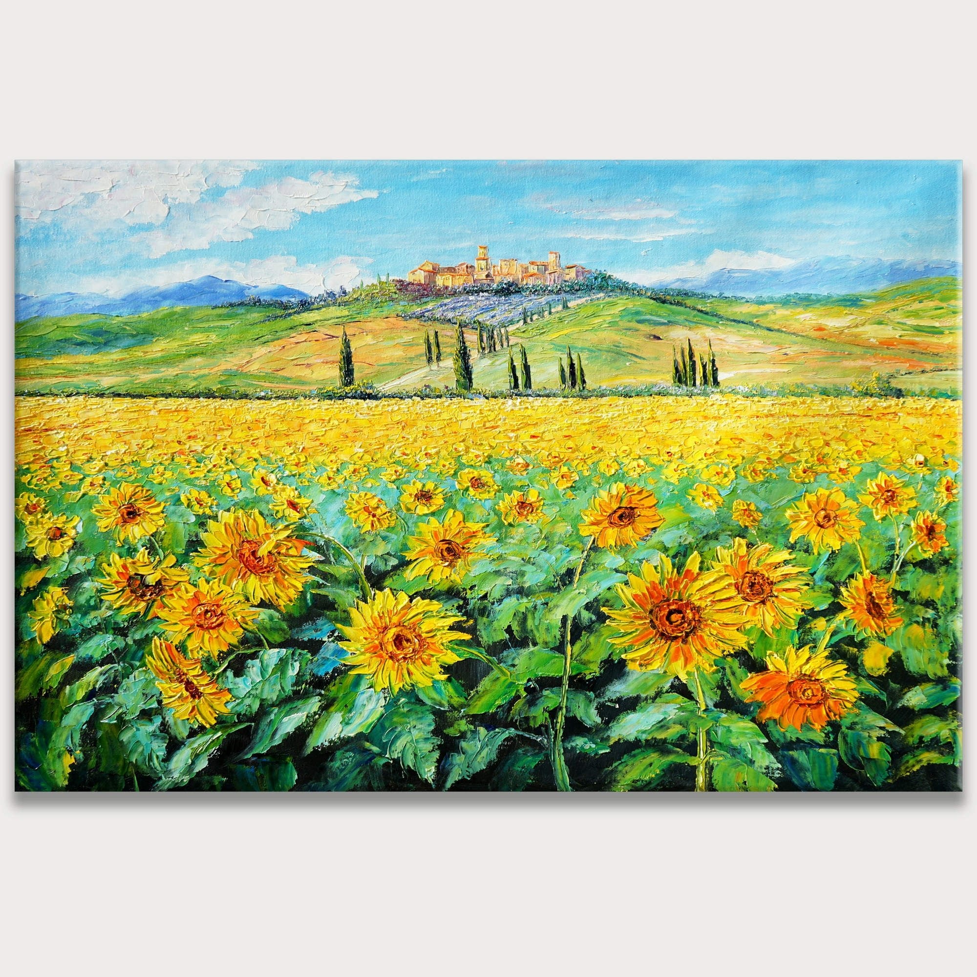 Quadro rappresentante un campo di girasoli in Toscana con un borgo sullo sfondo