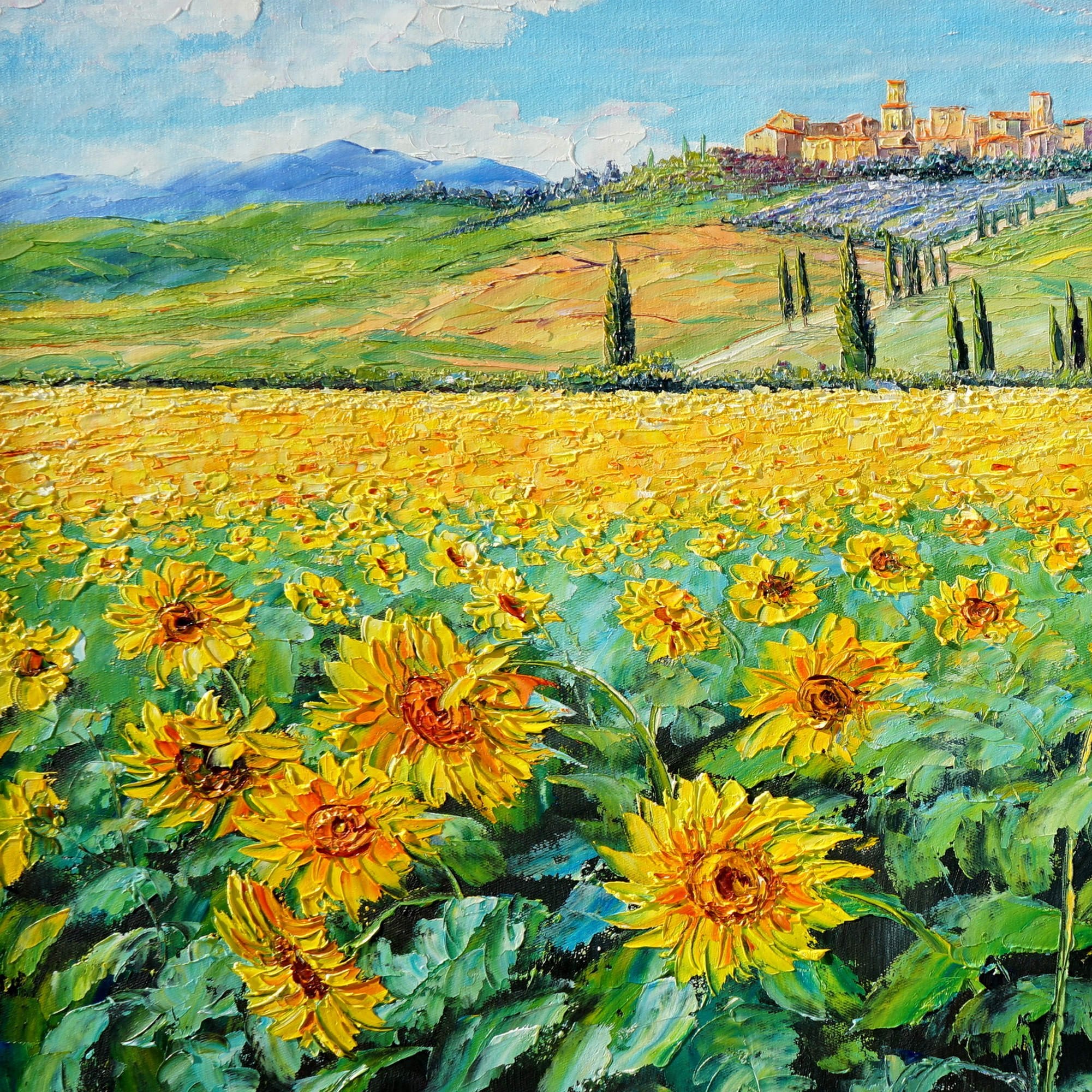 Quadro rappresentante un campo di girasoli in Toscana con un borgo sullo sfondo